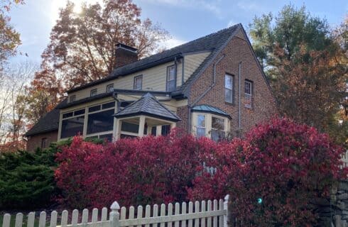 Back of house with fire bush in the fall